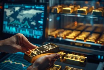 gold-bars-being-placed-into-safe-by-treasury-officer-with-financial-charts-screen-nearby_41097-27065.jpg